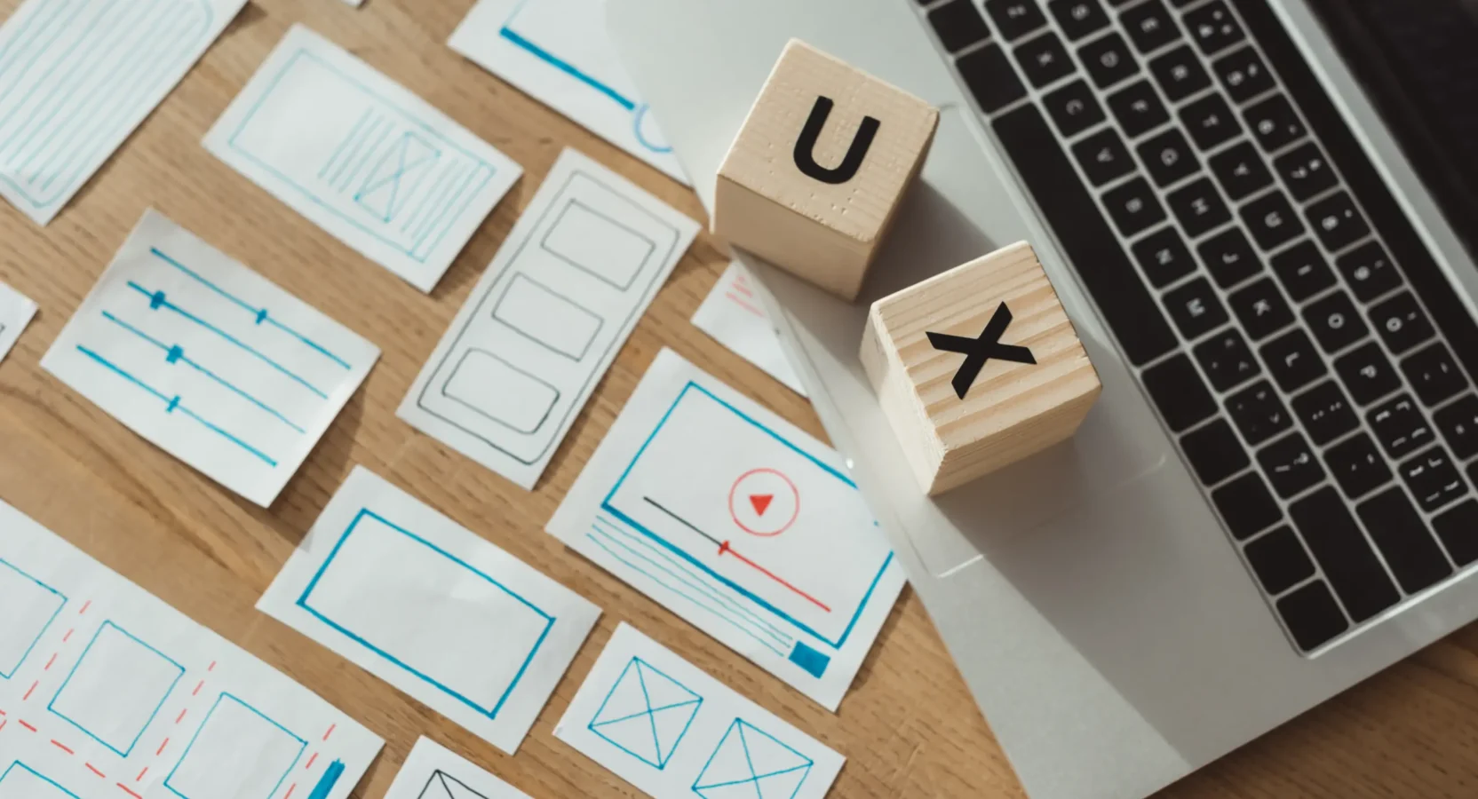 high-angle-view-of-cubes-with-ux-letters-on-laptop-2023-11-27-04-58-53-utc